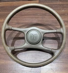 1984-1988 Pontiac Fiero Brown 4-SPOKE Steering Wheel & Horn Pad. Fixed Price $79.00.