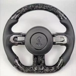 Mustang Carbon Fiber Steering Wheel - Forged Cobra Logo Perforated Leather. Fixed Price $599.99.