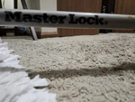 Master Lock Steering Wheel With Key. Fixed Price $35.00.
