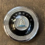 1946-1948 Plymouth Steering Wheel Center Cap 1115946, Good Condition. Fixed Price $30.00.