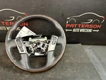 17-18 Nissan Titan Leather Wrapped Steering Wheel Black Brown. Fixed Price $175.00.
