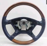 2001-2004 Mitsubishi Montero Limited Steering Wheel W/ Woodgrain Leather. Fixed Price $213.00.