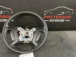 09-10 Saturn Outlook Black Leather Wrapped Steering Wheel W/ Accessory Controls. Fixed Price $125.00.