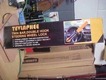 Tevlaphee Steering Wheel Lock Twin Bar Double Hook Car Auto Anti-theft Device. Fixed Price $20.00.