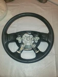 Nice 2004-2009 Dark Slate Dodge Ram Leather Steering Wheel With Radio Buttons. Fixed Price $200.00.
