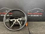 03-06 Jeep Wrangler Black Leather Wrapped Steering Wheel 5JG621X9AB. Fixed Price $125.00.