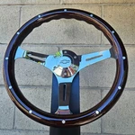 14" Chrome Steering Wheel W/ Dark Wood Grip, Chevy Horn, And Adapter. Fixed Price $248.38.