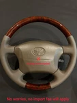Toyota Land Cruiser 100 Series Steering Wheel Wood Grain. Fixed Price $250.00.